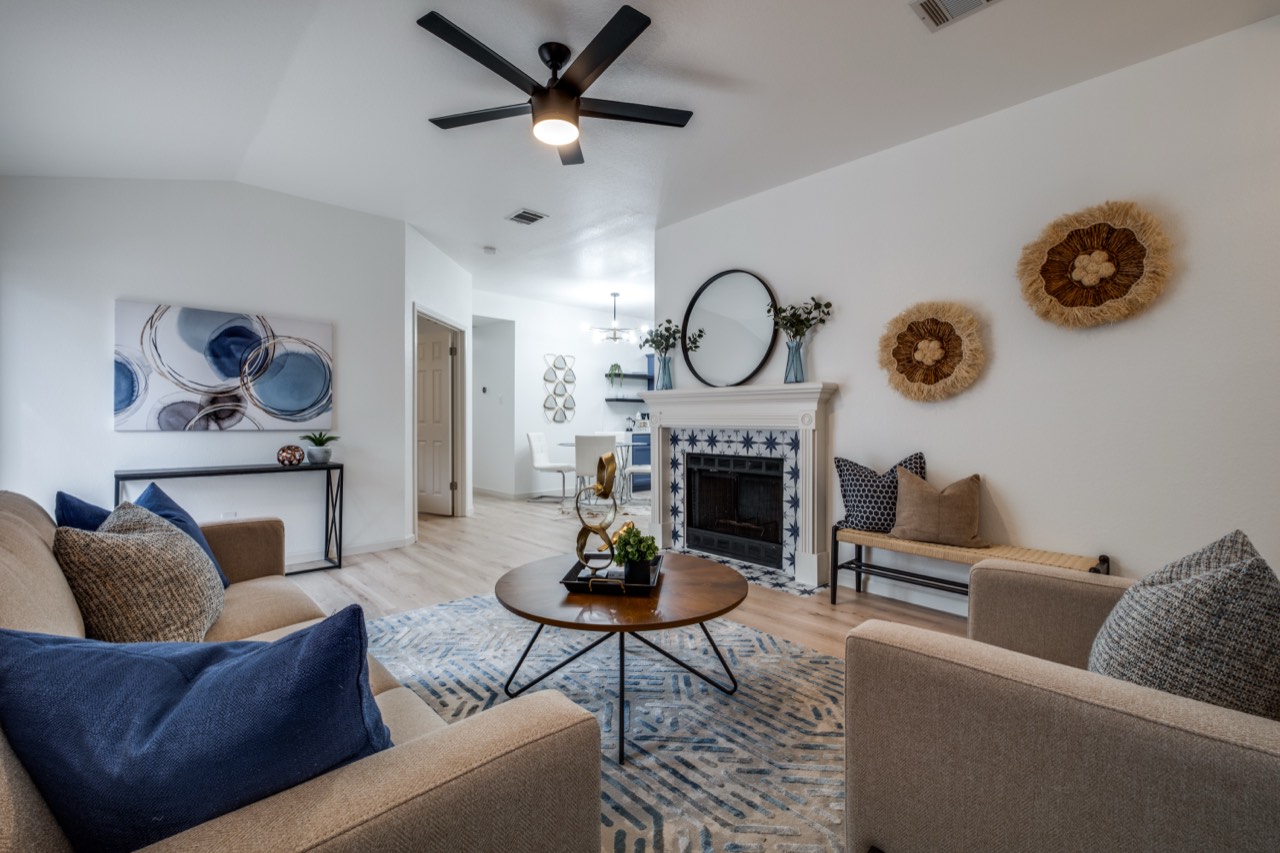 Styled living room with a tiled fireplace in a Cedar Park, Austin home